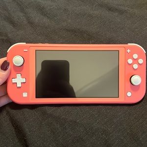 Nintendo Switch Lite. Animal crossing game. Mariokart deluxe game